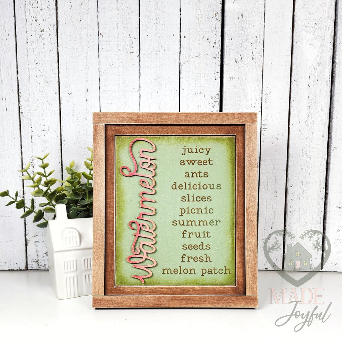Watermelon word-list insert with juicy, sweet, ants, delicious, slices, picnic, summer, fruit, seeds, fresh, and melon patch on sage green, in a stained farmhouse frame.