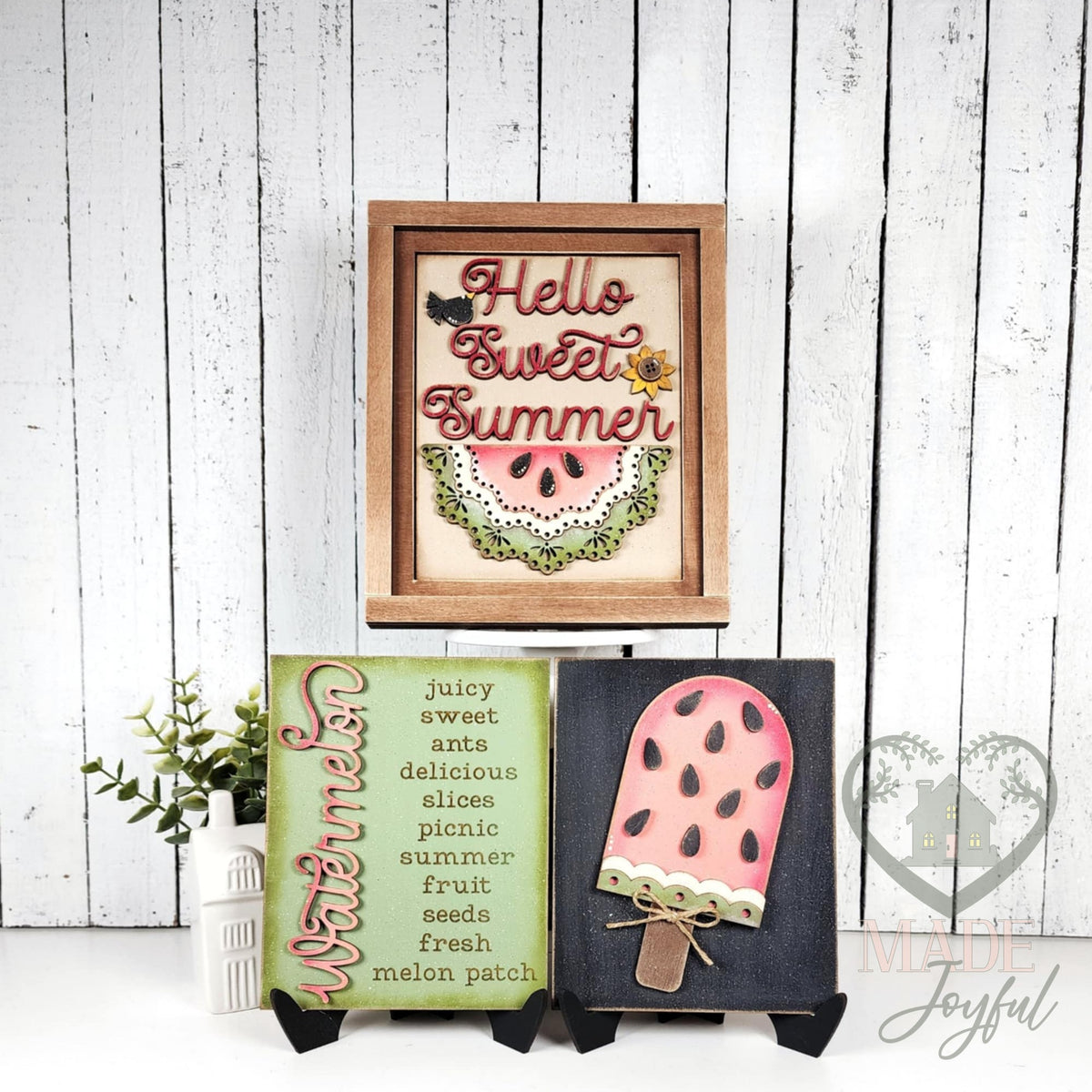 Watermelon insert trio styled together: Hello Sweet Summer in a stained farmhouse frame above the Watermelon word-list sign and watermelon popsicle on stands.