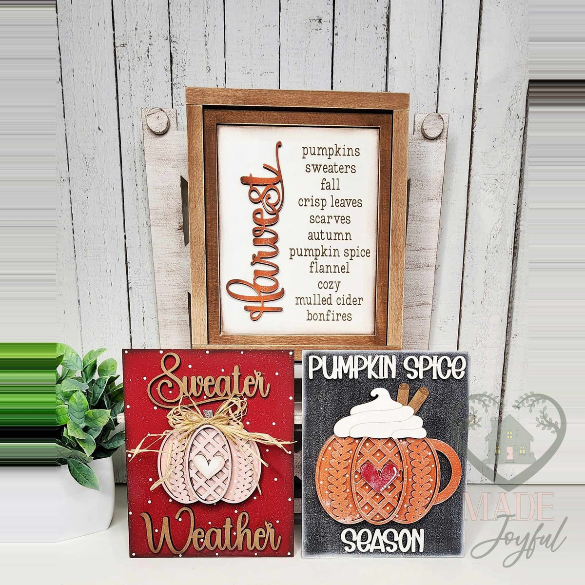 Pumpkin Spice Season insert trio of hand-painted 3D wood signs: a Harvest word list in a stained frame with Sweater Weather and Pumpkin Spice Season inserts in front, made in Brentwood, TN.