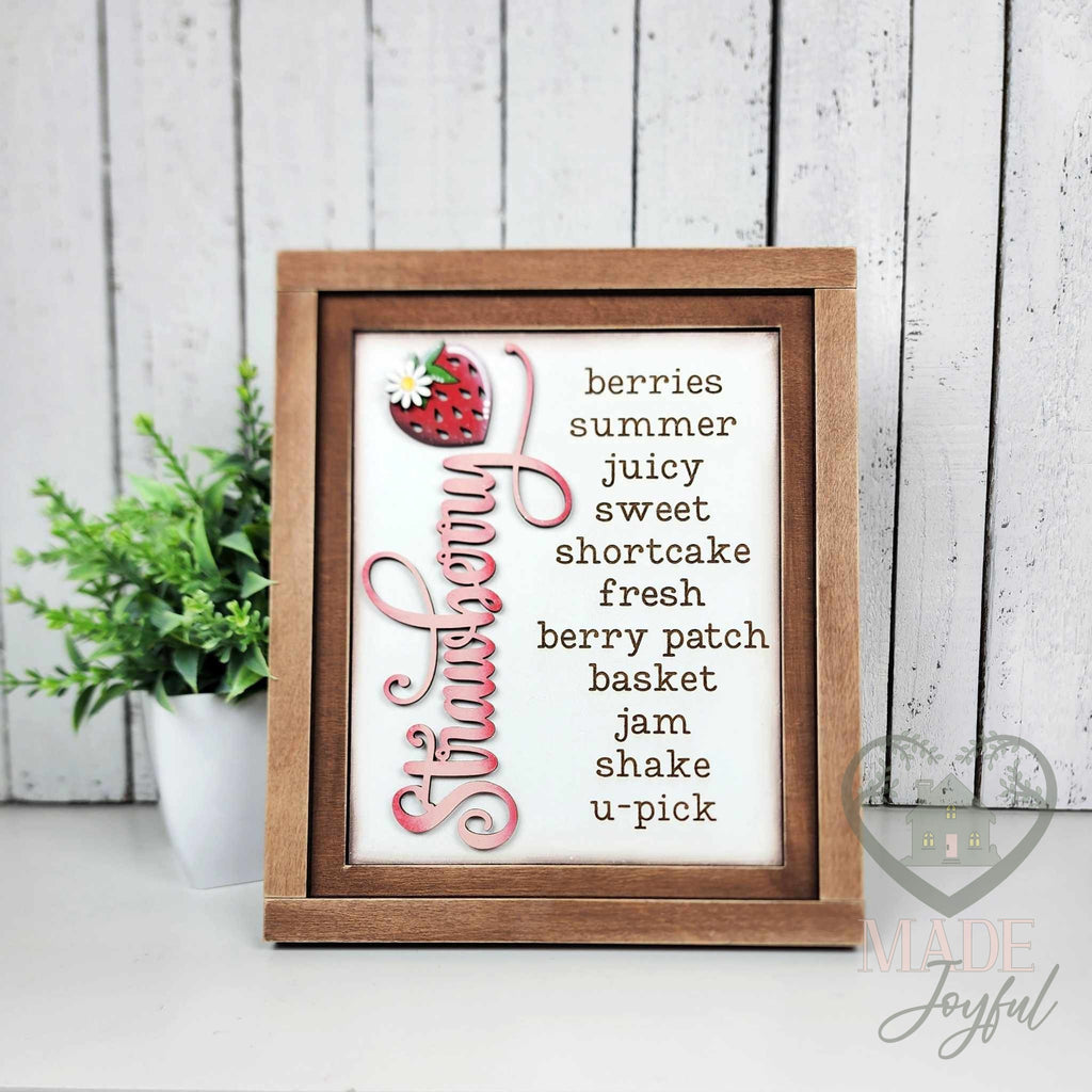 Strawberry word-list 3D wood insert in a stained 7x8 farmhouse frame, hand-painted with a red strawberry, daisy, and the words berries, summer, juicy, shortcake, berry patch, and u-pick.