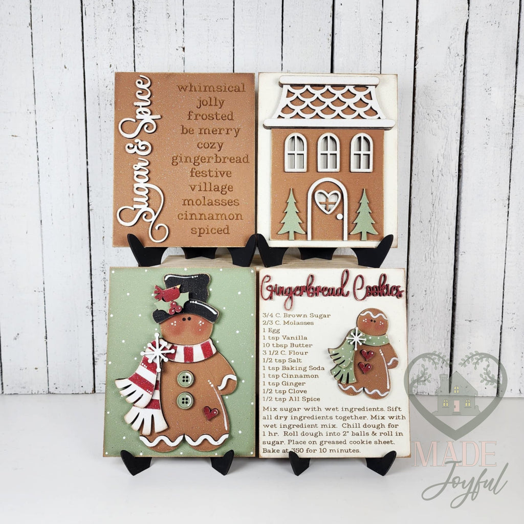 Victorian Gingerbread interchangeable insert set of four hand-painted 3D wood signs: Sugar & Spice word list, gingerbread house, gingerbread friend in a top hat and scarf, and a Gingerbread Cookies recipe card.