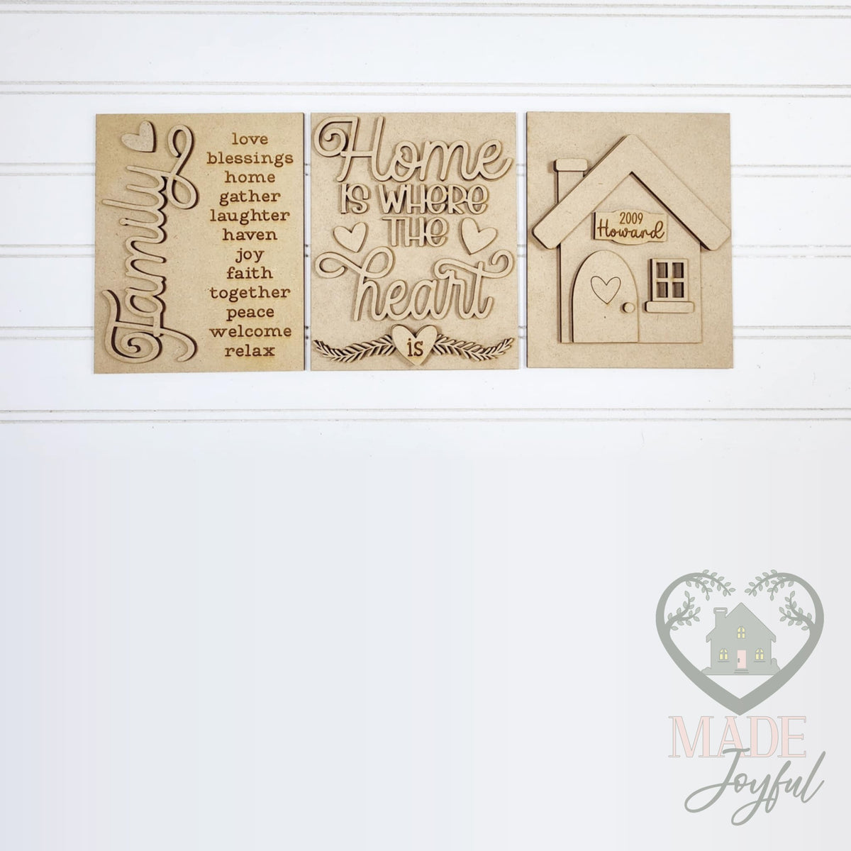 Unfinished laser-cut wood Home trio DIY kit with Family word list, Home Is Where the Heart Is, and house inserts, ready to paint at a DIY party in Williamson County, TN.