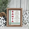 SANTA word-list insert with jolly, merry, believe, ho ho ho, cheer, jingle, cookies, stockings, toys, chimney, and elves with red letters and green stripes in a stained farmhouse frame.
