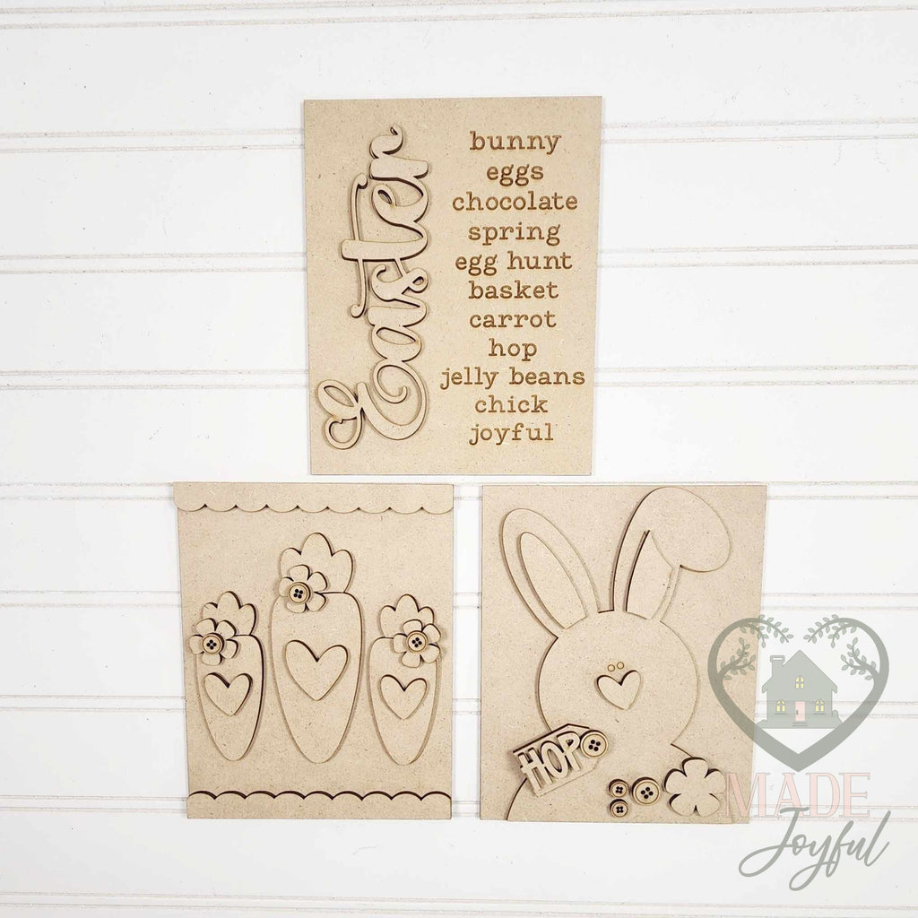 Unfinished laser-cut wood Prim Easter trio DIY kit with Easter word list, carrot, and bunny inserts, ready to paint at a DIY party in Williamson County, TN.