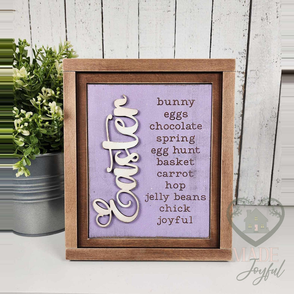 Easter word-list insert with bunny, eggs, chocolate, spring, egg hunt, basket, carrot, hop, jelly beans, chick, and joyful on lavender, in a stained farmhouse frame.