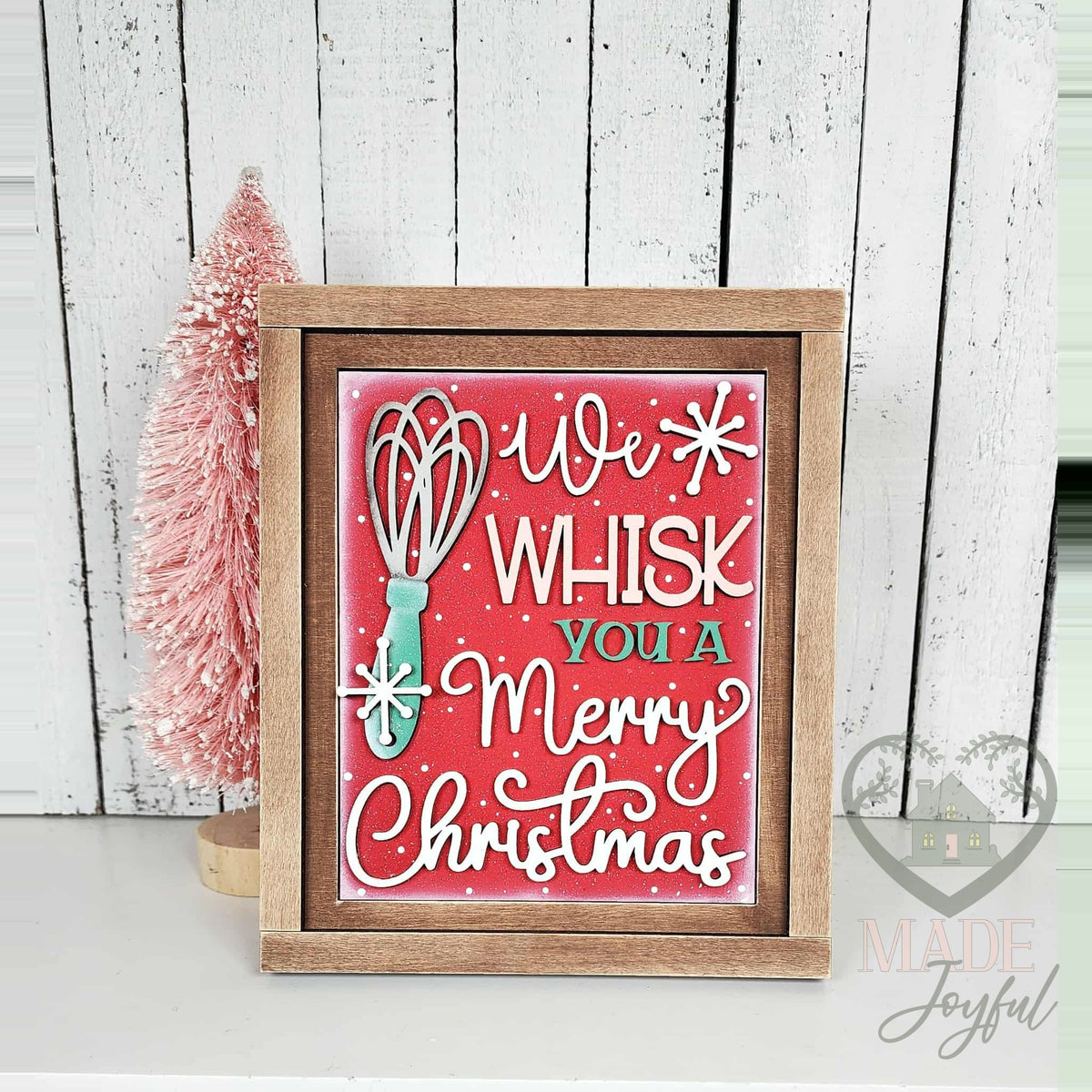 We Whisk You a Merry Christmas 3D wood insert with a mint whisk and white script on red in a stained farmhouse frame.