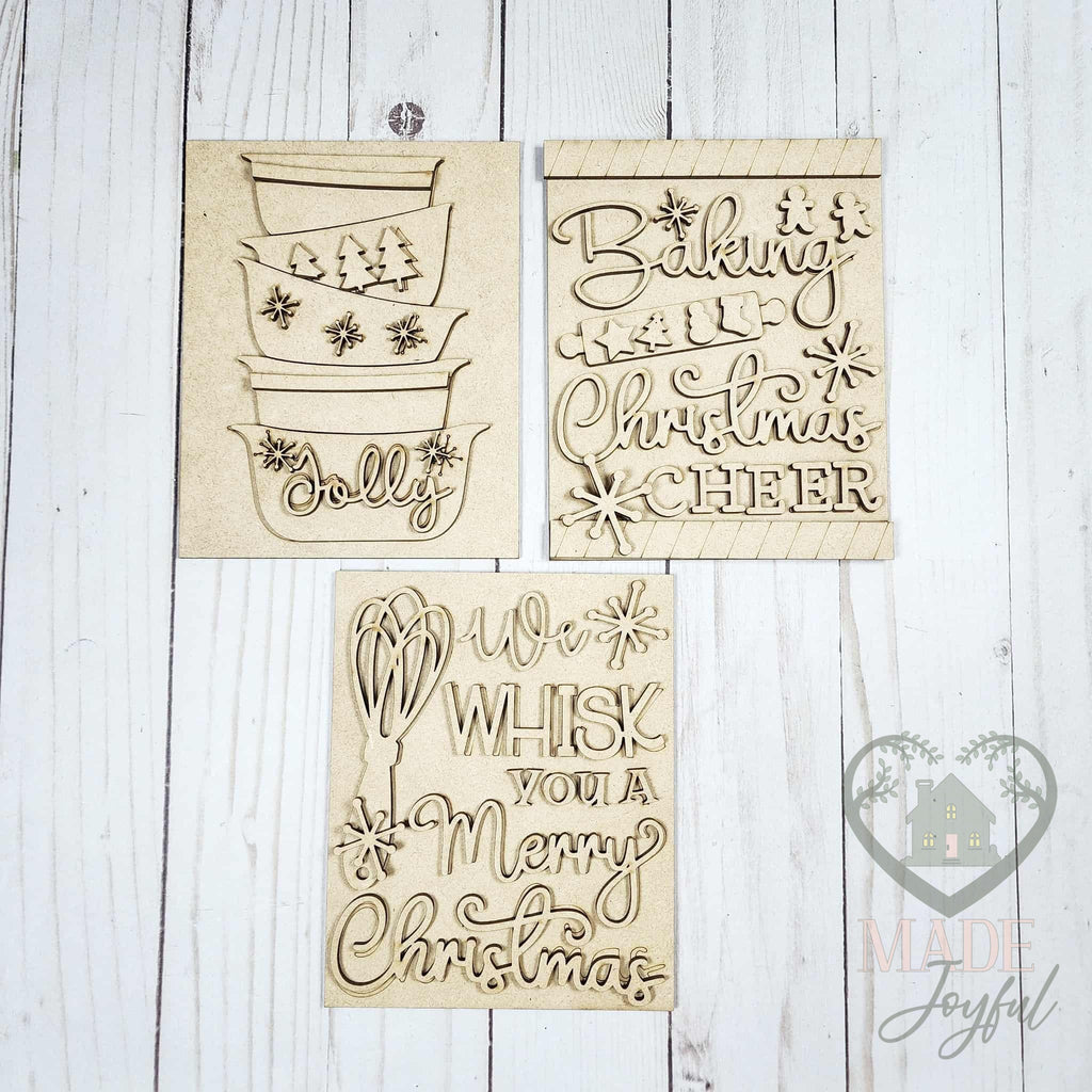 Unfinished laser-cut wood Christmas Baking trio DIY kit with mixing bowls, Baking Christmas Cheer, and We Whisk You inserts, ready to paint at a DIY party in Williamson County, TN.