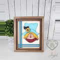 Scarecrow face 3D wood insert with a teal hat, sunflower, crow, yellow straw hair, and red scarf with teal stripes, in a stained farmhouse frame.
