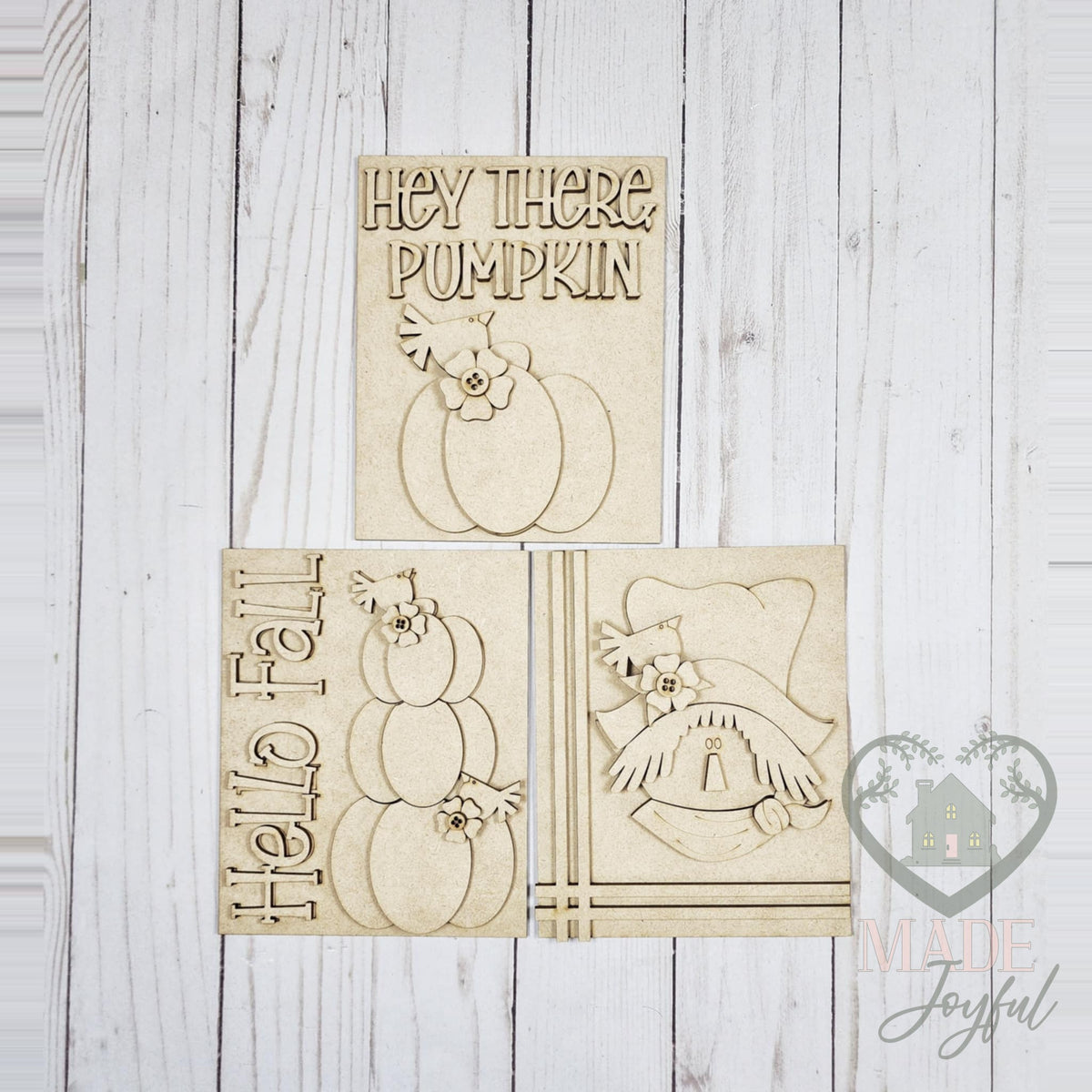 Unfinished laser-cut wood Fall Scarecrow trio DIY kit with Hey There Pumpkin, Hello Fall, and scarecrow inserts, ready to paint at a DIY party in Williamson County, TN.