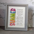 SUMMER word-list 3D wood insert with rainbow ombre letters and the words flip flops, sunshine, popsicles, fireflies, beach, barbeques, sunglasses, tan lines, fireworks, bare feet, and lemonade, in a gray farmhouse frame, hand-painted in Brentwood, TN.