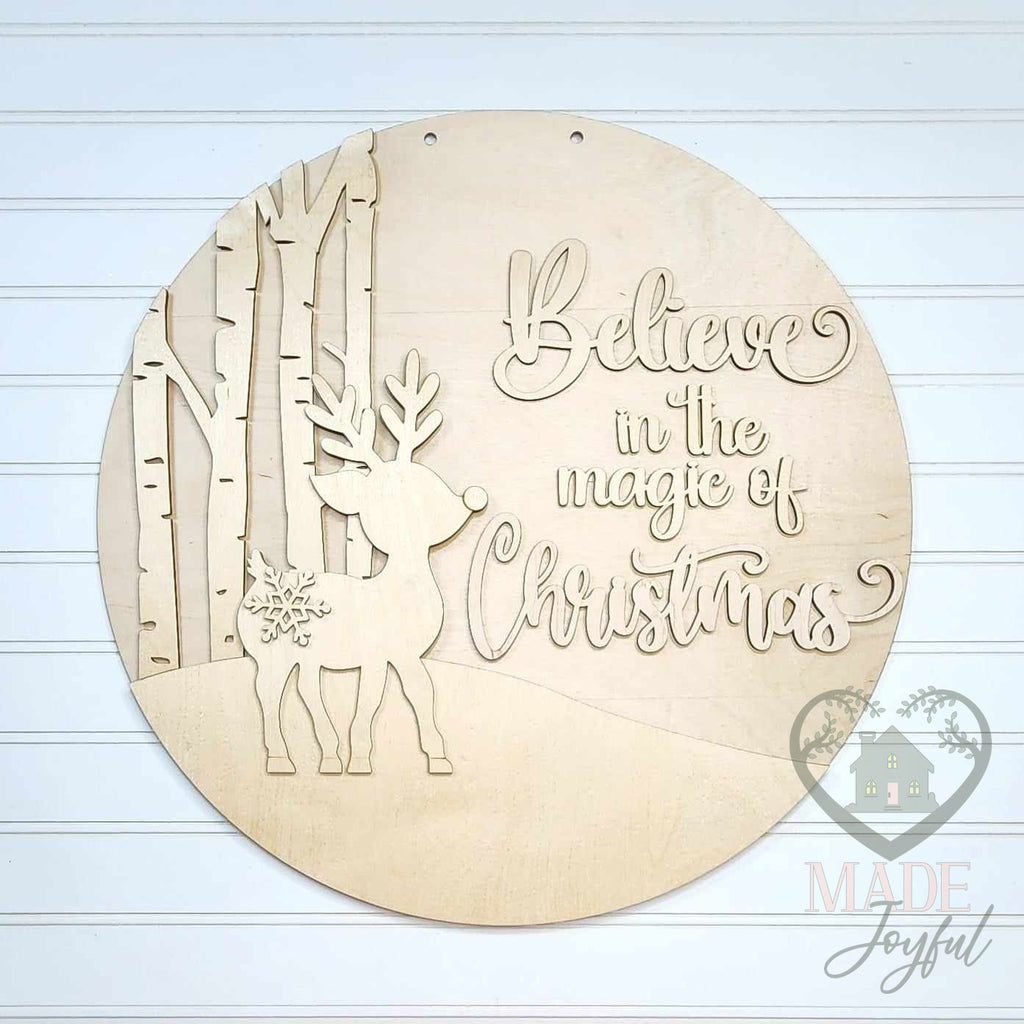 Unfinished laser-cut wood Believe in the Magic of Christmas reindeer door hanger kit, ready to paint at a DIY party in Williamson County, TN.