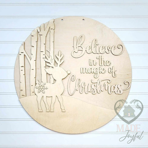 Unfinished laser-cut wood Believe in the Magic of Christmas reindeer door hanger kit, ready to paint at a DIY party in Williamson County, TN.