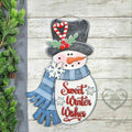 Sweet Winter Wishes snowman 3D wood door hanger with a black top hat, candy cane, blue scarf, and red script, hand-painted in Brentwood, TN.