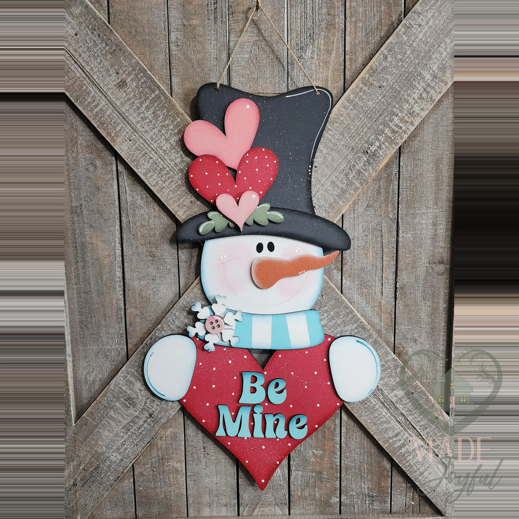 Be Mine Valentine snowman 3D wood door hanger with a heart-topped black hat, aqua scarf, and a red polka-dot heart, hand-painted in Brentwood, TN.