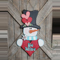 Be Mine Valentine snowman 3D wood door hanger with a heart-topped black hat, aqua scarf, and a red polka-dot heart, hand-painted in Brentwood, TN.