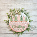 Merry Christmas Trees round wood door hanger with snowy green plaid trees and sage script on blush pink, with a green gingham bow and greenery, hand-painted in Brentwood, TN.