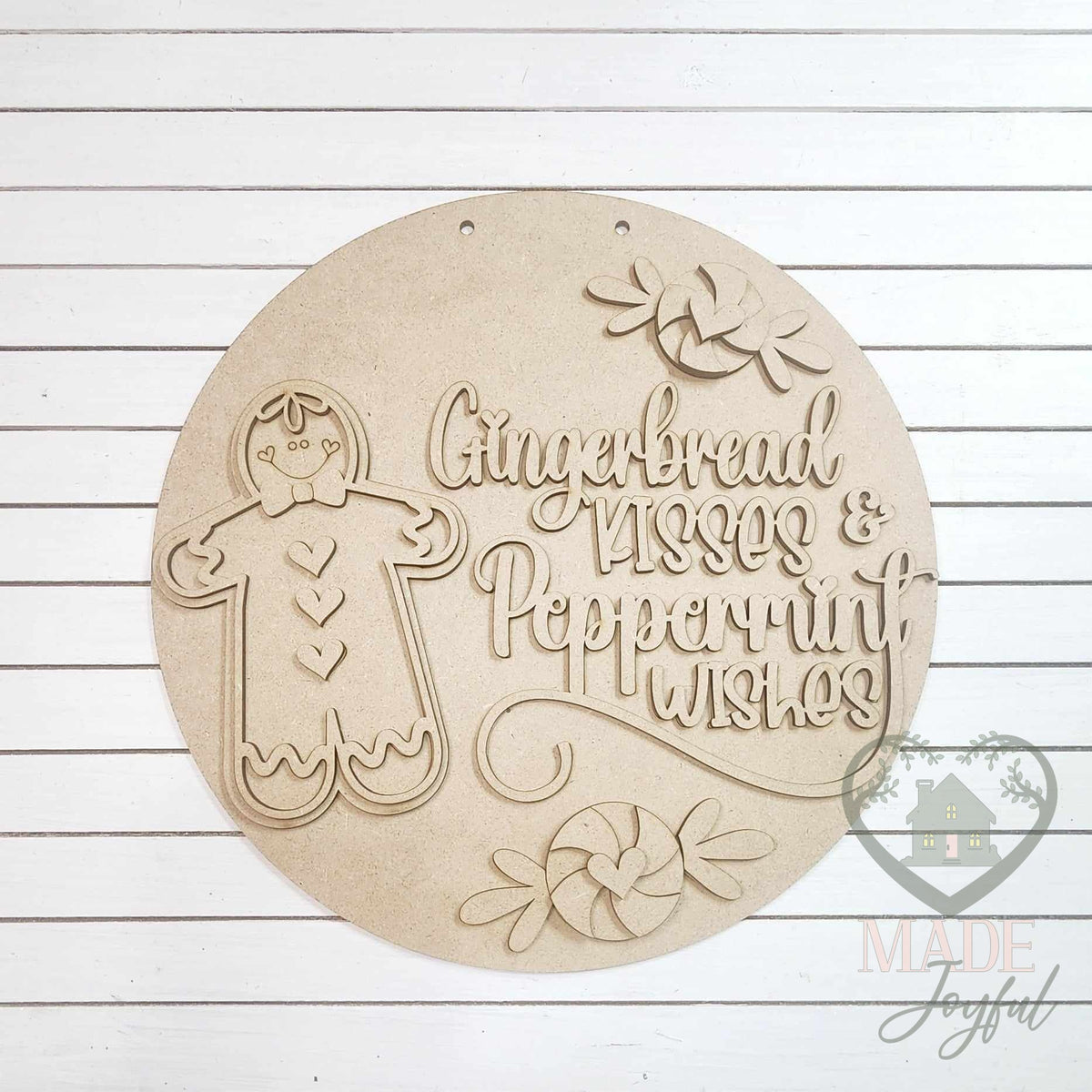 Unfinished laser-cut wood Gingerbread Kisses and Peppermint Wishes door hanger kit, ready to paint at a DIY party in Williamson County, TN.