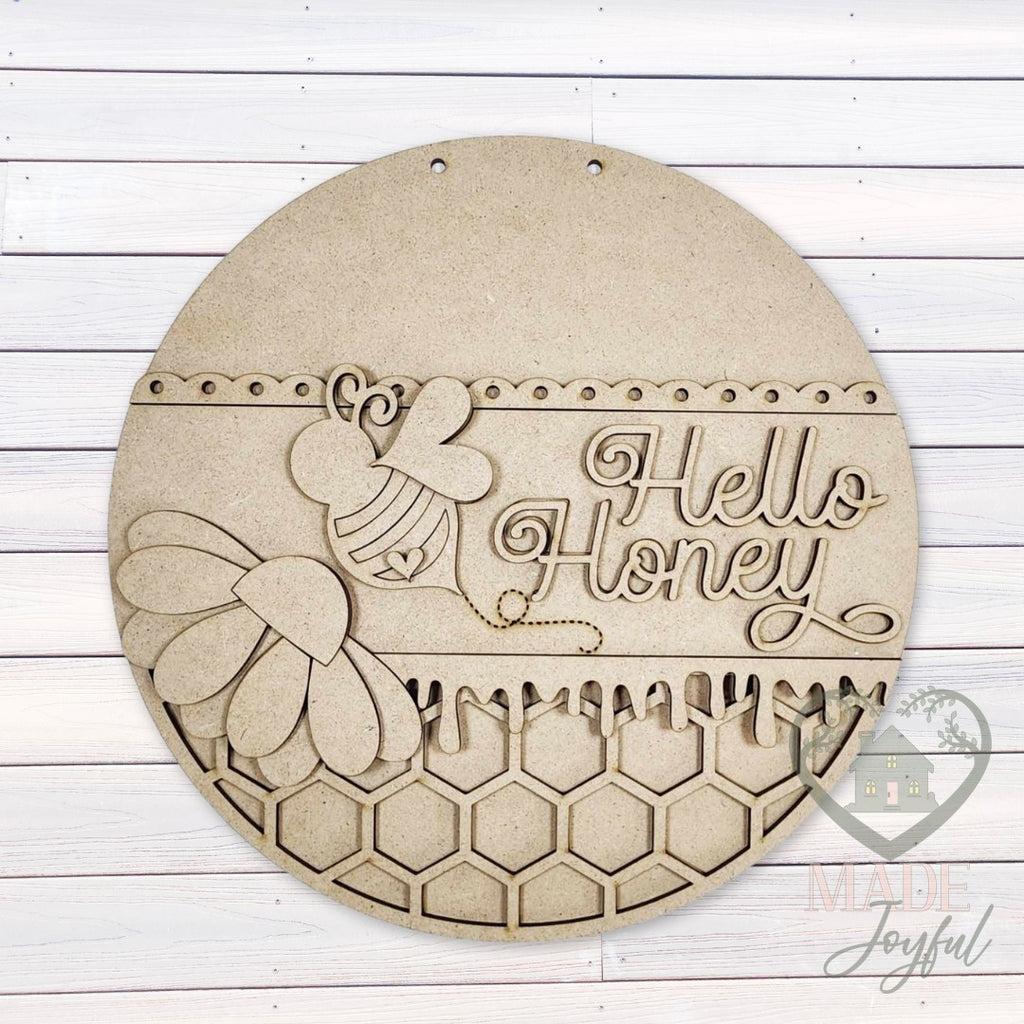 Unfinished laser-cut wood Hello Honey bee door hanger kit, ready to paint at a DIY party in Williamson County, TN.