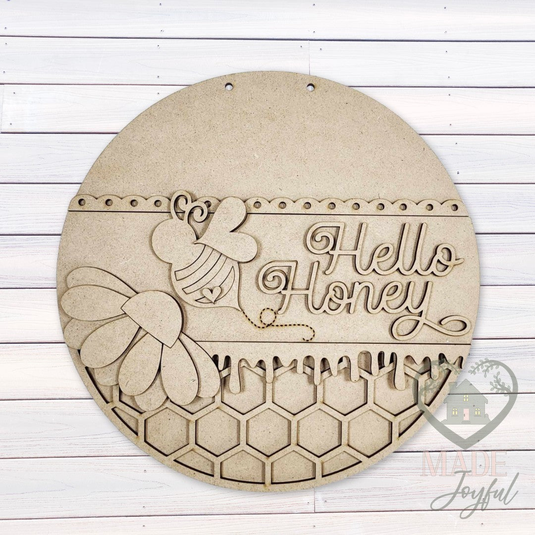 Unfinished laser-cut wood Hello Honey bee door hanger kit, ready to paint at a DIY party in Williamson County, TN.