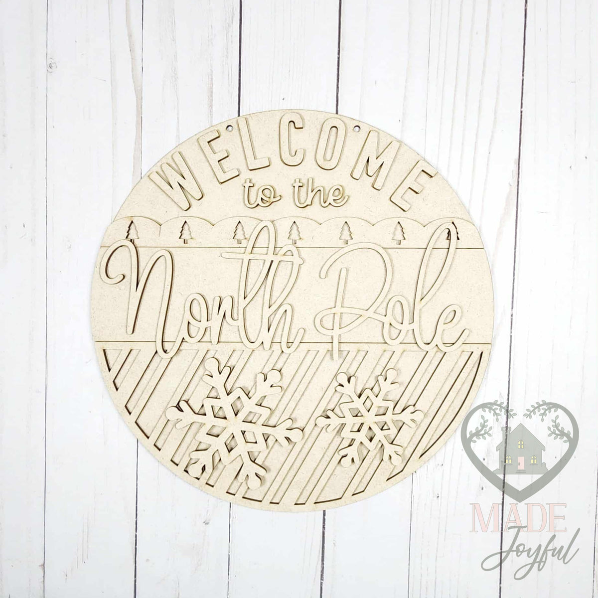 Unfinished laser-cut wood Welcome to the North Pole door hanger kit, ready to paint at a DIY party in Williamson County, TN.