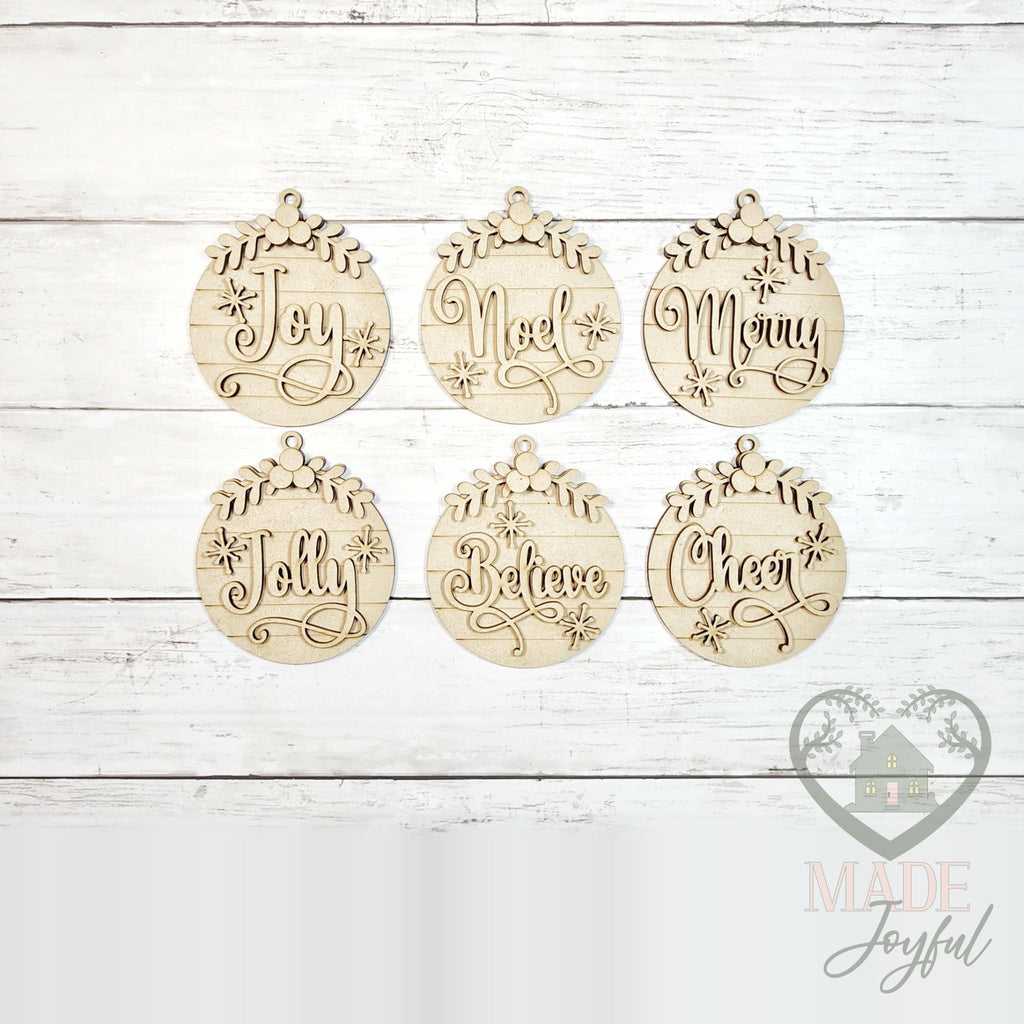 Unfinished laser-cut wood Classic Christmas ornament kit with six round word ornaments, ready to paint at a DIY party in Williamson County, TN.