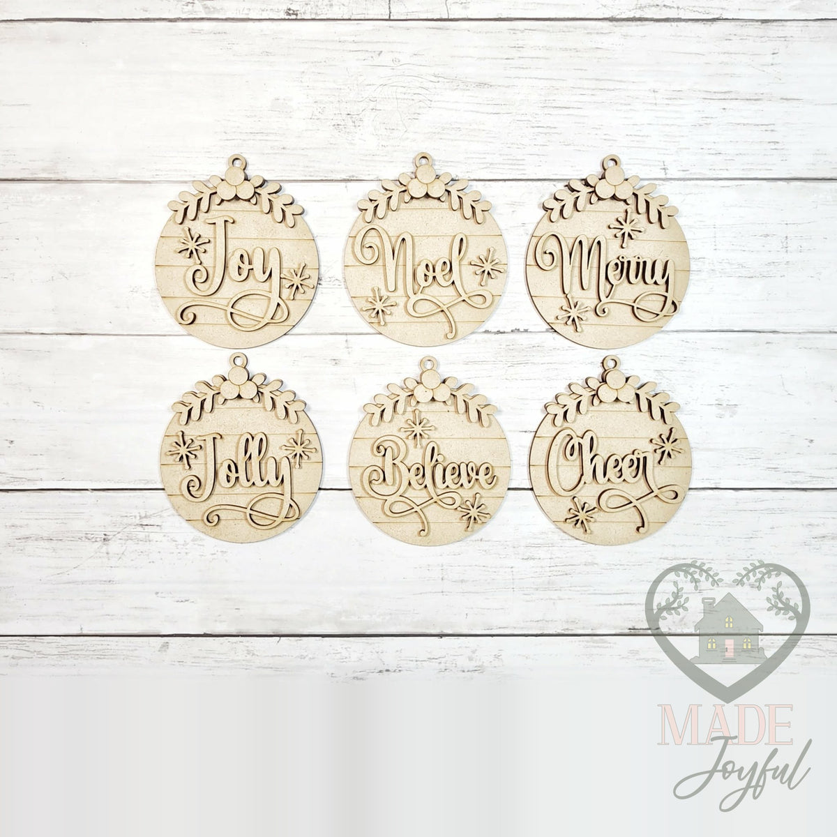 Unfinished laser-cut wood Classic Christmas ornament kit with six round word ornaments, ready to paint at a DIY party in Williamson County, TN.