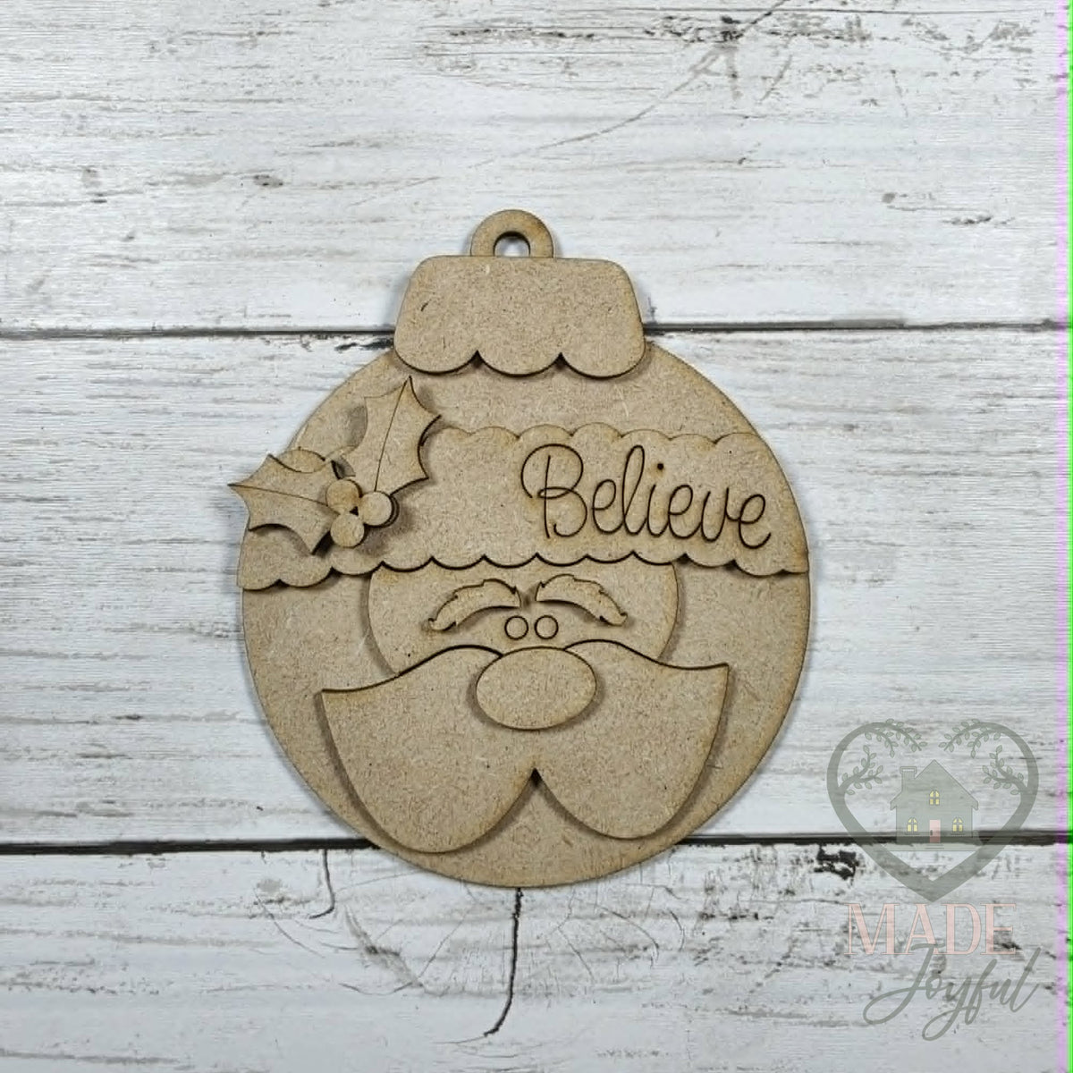 Unfinished laser-cut wood Santa bulb ornament kit, ready to paint at a DIY party in Williamson County, TN.