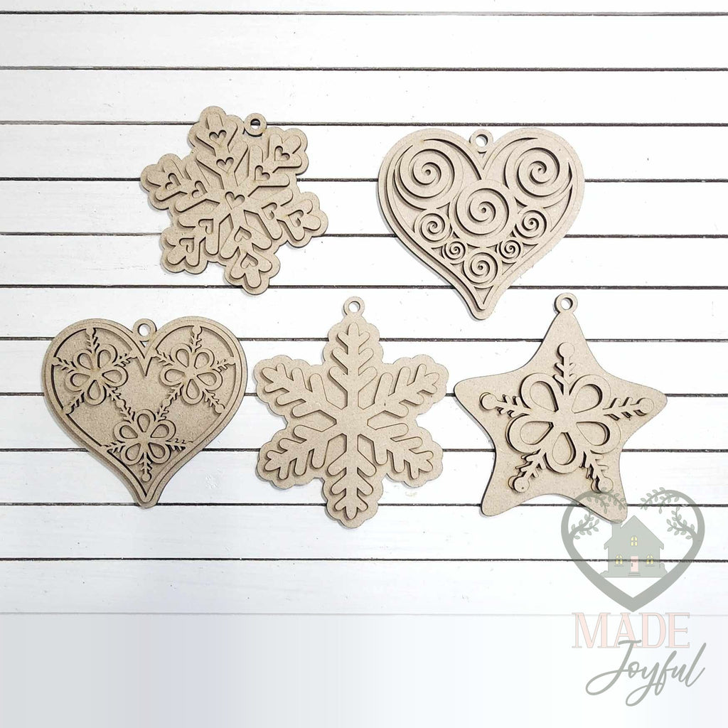 Unfinished laser-cut wood gingerbread cookie ornament kit with five shapes, ready to paint at a DIY party in Williamson County, TN.