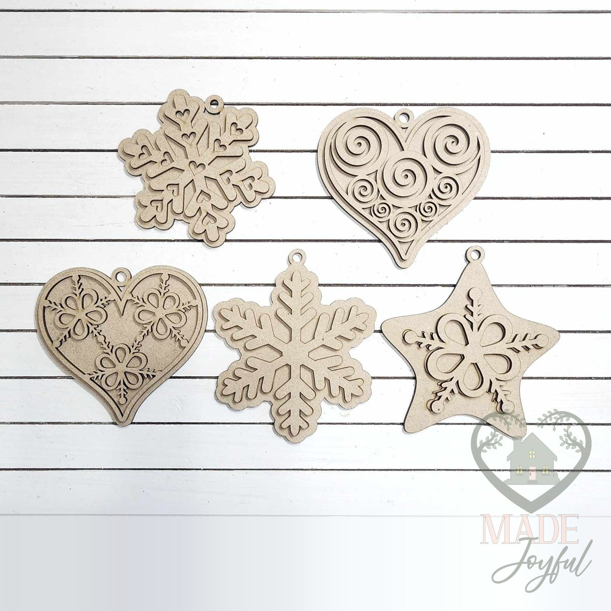 Unfinished laser-cut wood gingerbread cookie ornament kit with five shapes, ready to paint at a DIY party in Williamson County, TN.