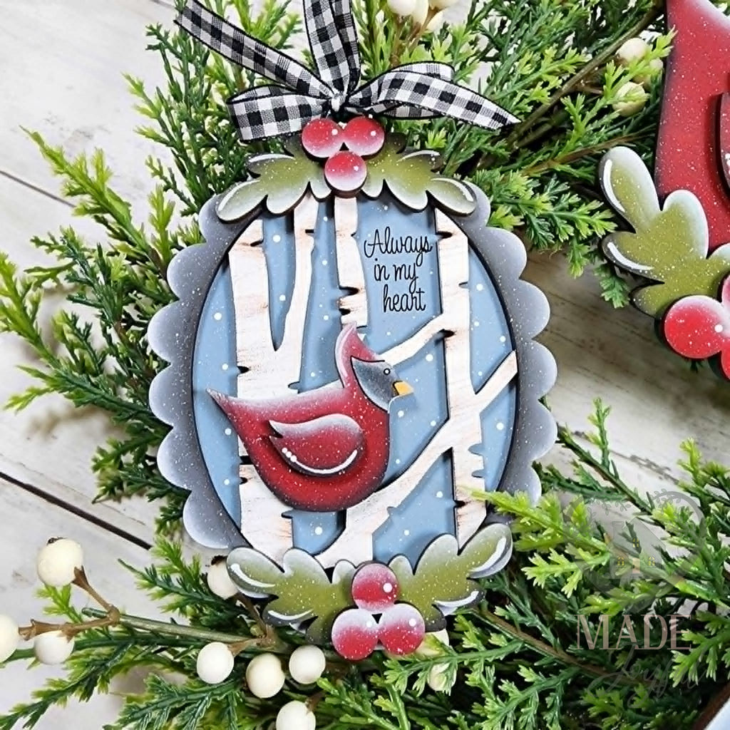 Cardinal frame ornament with birch trees and Always In My Heart script on blue, with holly and a gingham bow, hand-painted in Brentwood, TN.