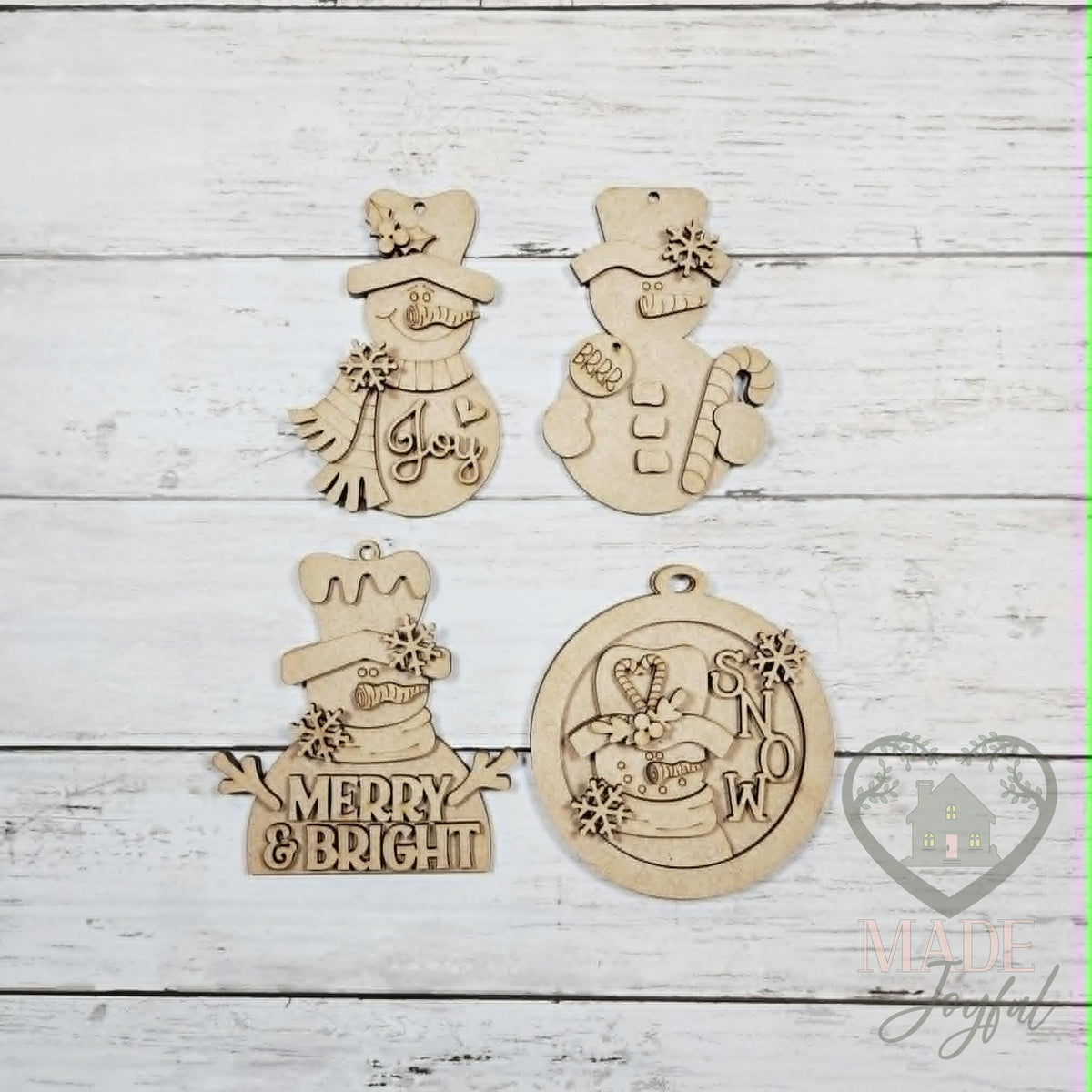 Unfinished laser-cut wood sweet snowman ornament kit with four ornaments, ready to paint at a DIY party in Williamson County, TN.