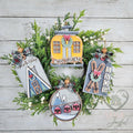 Ski lodge ornament set with an A-frame cabin tag, yellow gondola, skis SNOW tag and round ski-lift ornament on a wreath, hand-painted in Brentwood, TN.