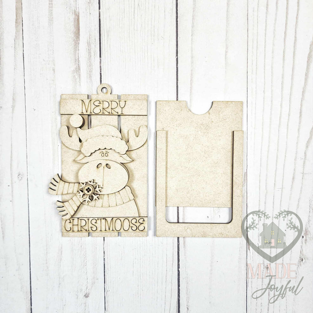 Unfinished laser-cut wood Merry Christmoose gift card holder ornament kit, ready to paint at a DIY party in Williamson County, TN.
