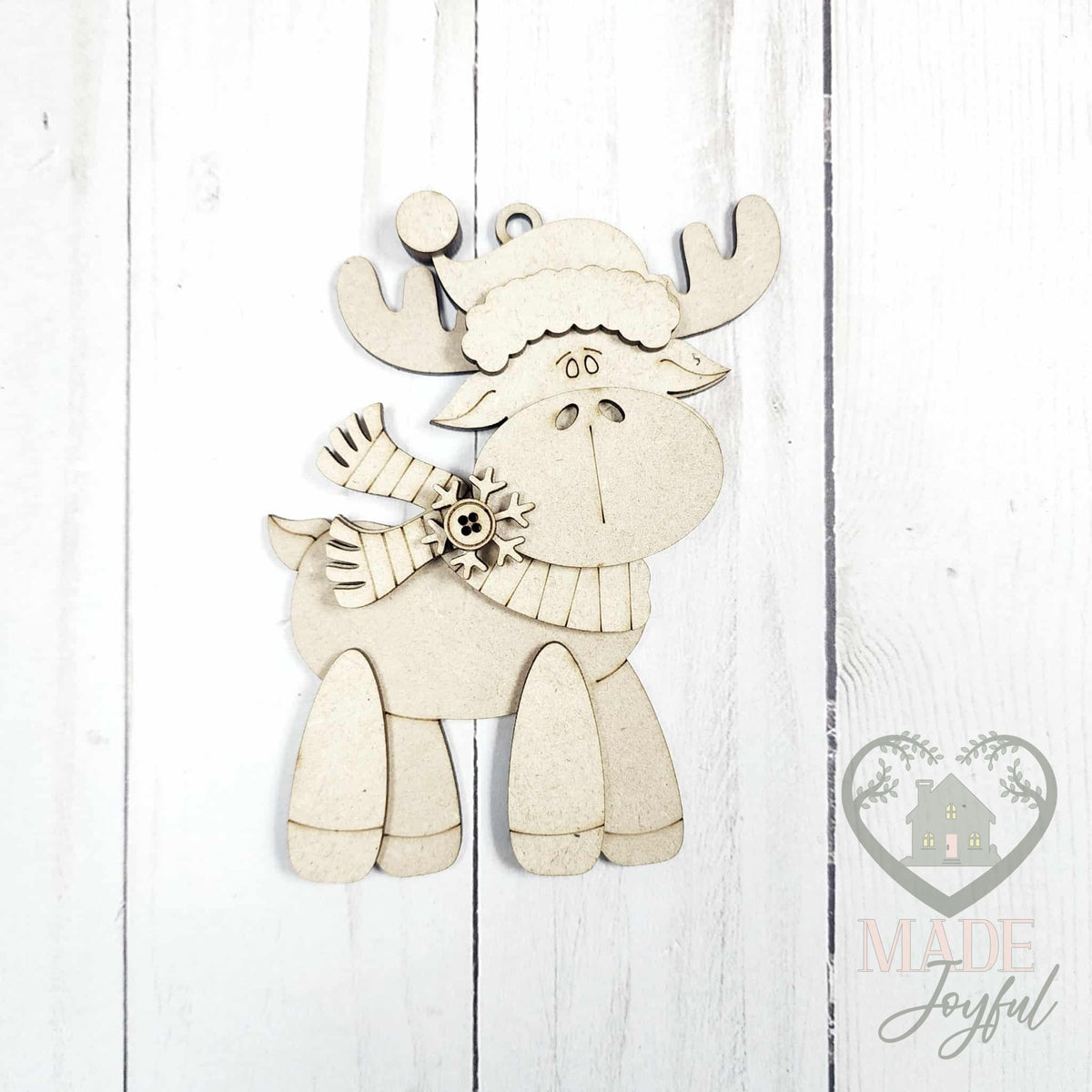 Unfinished laser-cut wood standing moose ornament kit, ready to paint at a DIY party in Williamson County, TN.