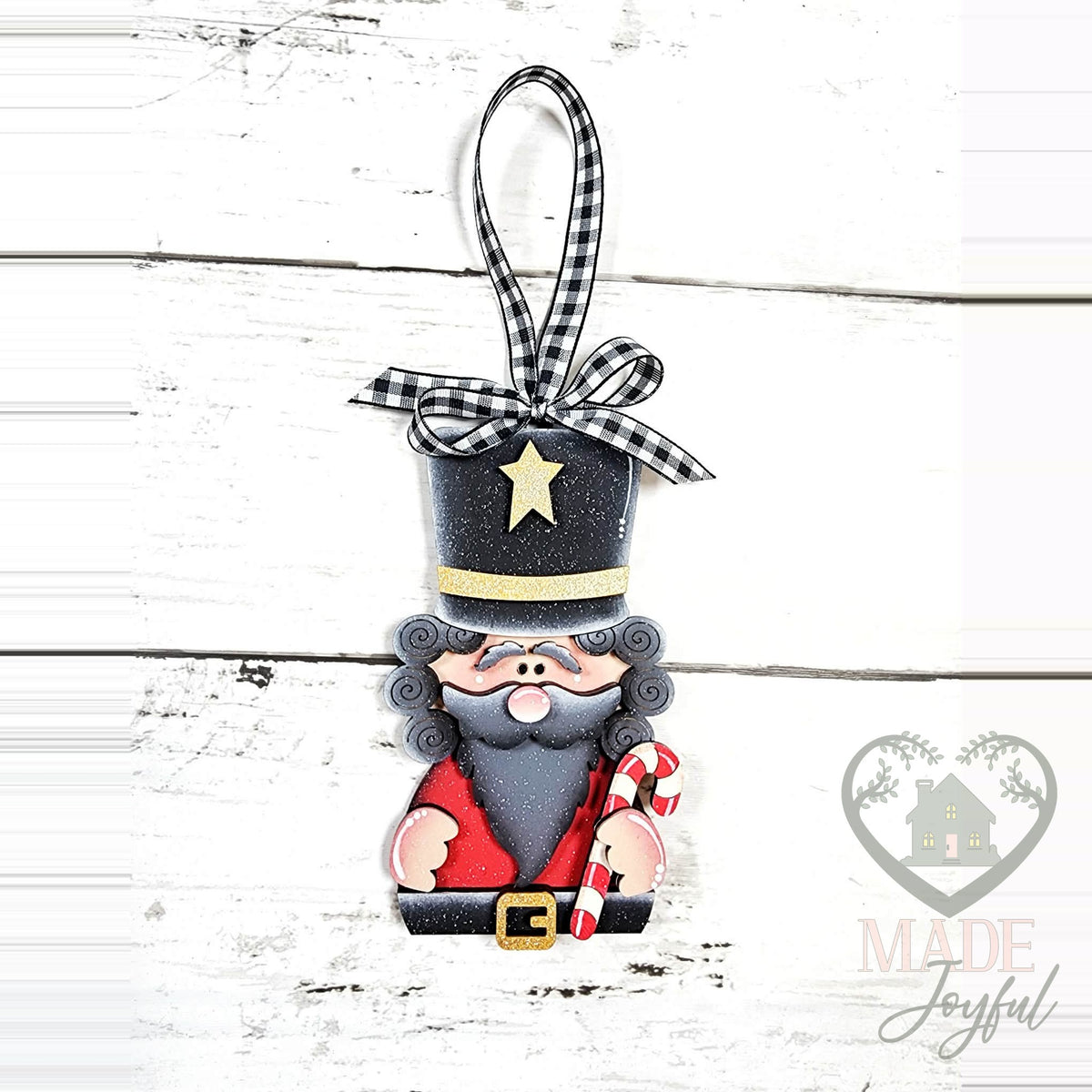 Standing nutcracker ornament with a tall black hat, gray curls and a candy cane, hand-painted in Brentwood, TN.