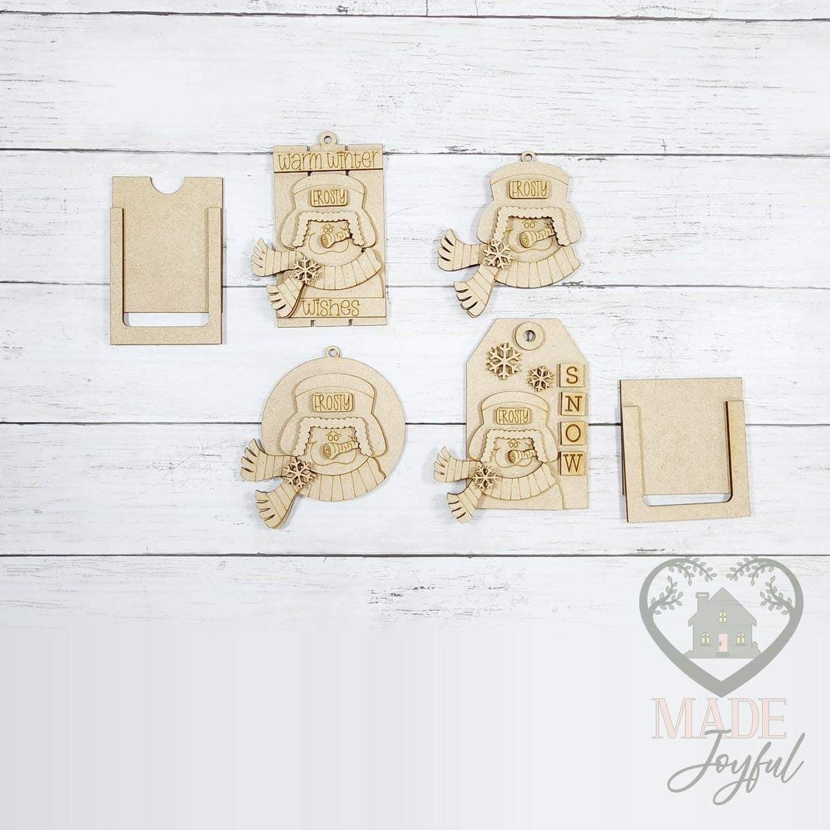 Unfinished laser-cut wood winter snowmen ornament kit with gift card holder pieces, ready to paint at a DIY party in Williamson County, TN.
