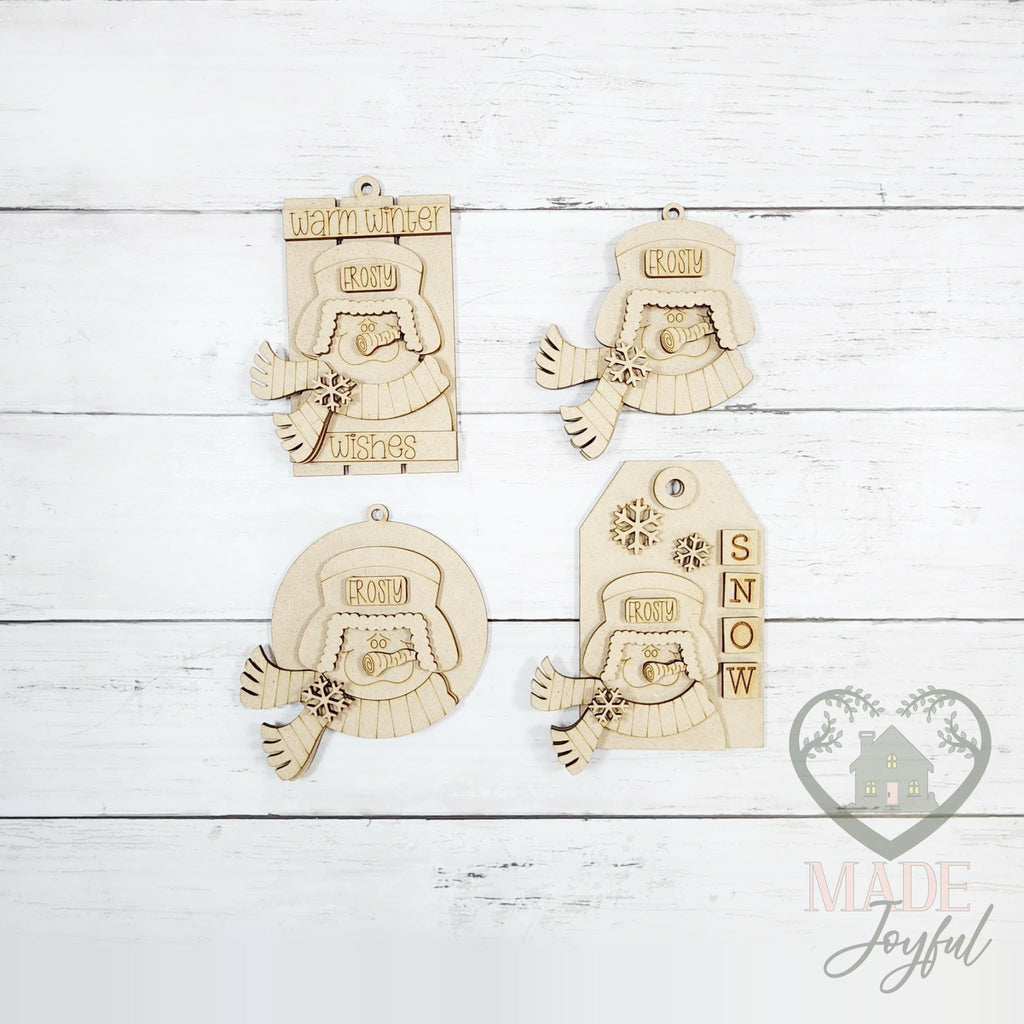 Unfinished laser-cut wood winter snowmen ornament kit with four ornaments, ready to paint at a DIY party in Williamson County, TN.