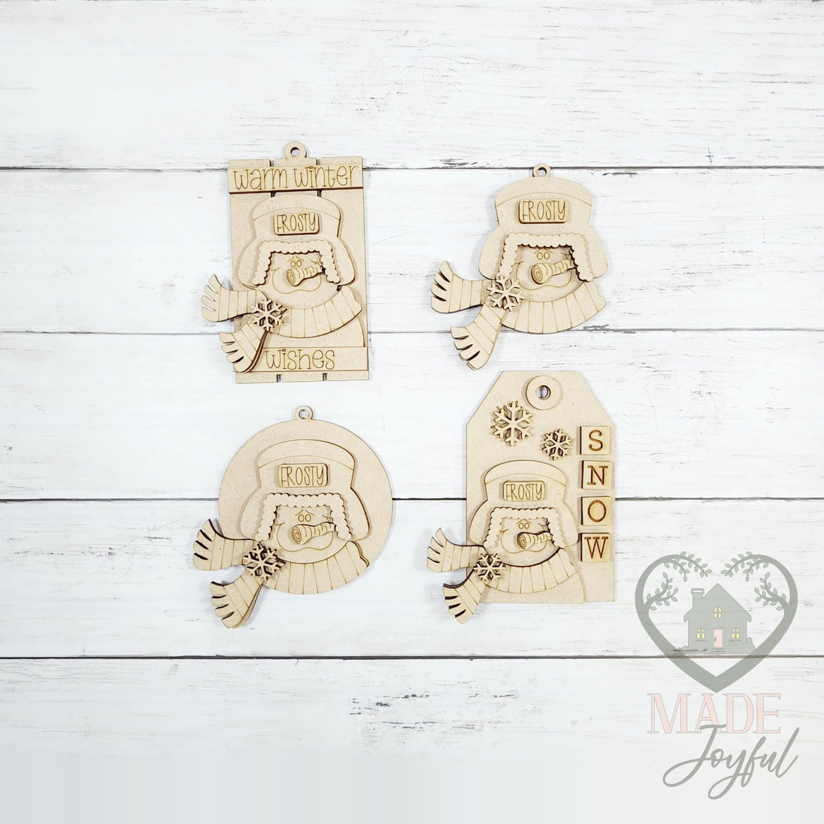 Unfinished laser-cut wood winter snowmen ornament kit with four ornaments, ready to paint at a DIY party in Williamson County, TN.
