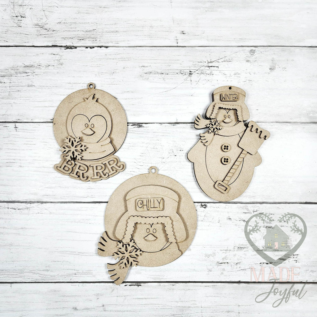Unfinished laser-cut wood penguin ornament kit with three ornaments, ready to paint at a DIY party in Williamson County, TN.
