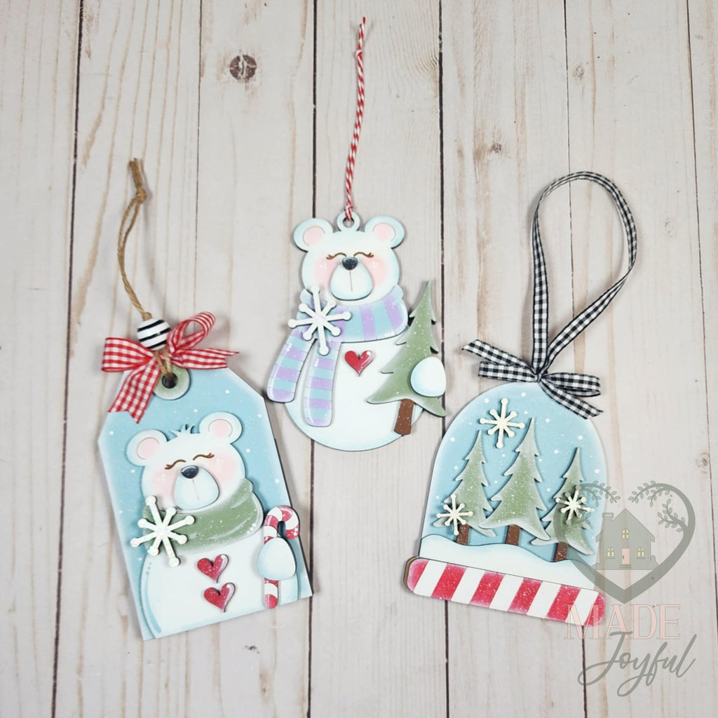 Polar bear ornament set with a polar bear tag, standing polar bear and snow globe of pine trees, hand-painted in Brentwood, TN.