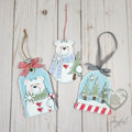 Polar bear ornament set with a polar bear tag, standing polar bear and snow globe of pine trees, hand-painted in Brentwood, TN.