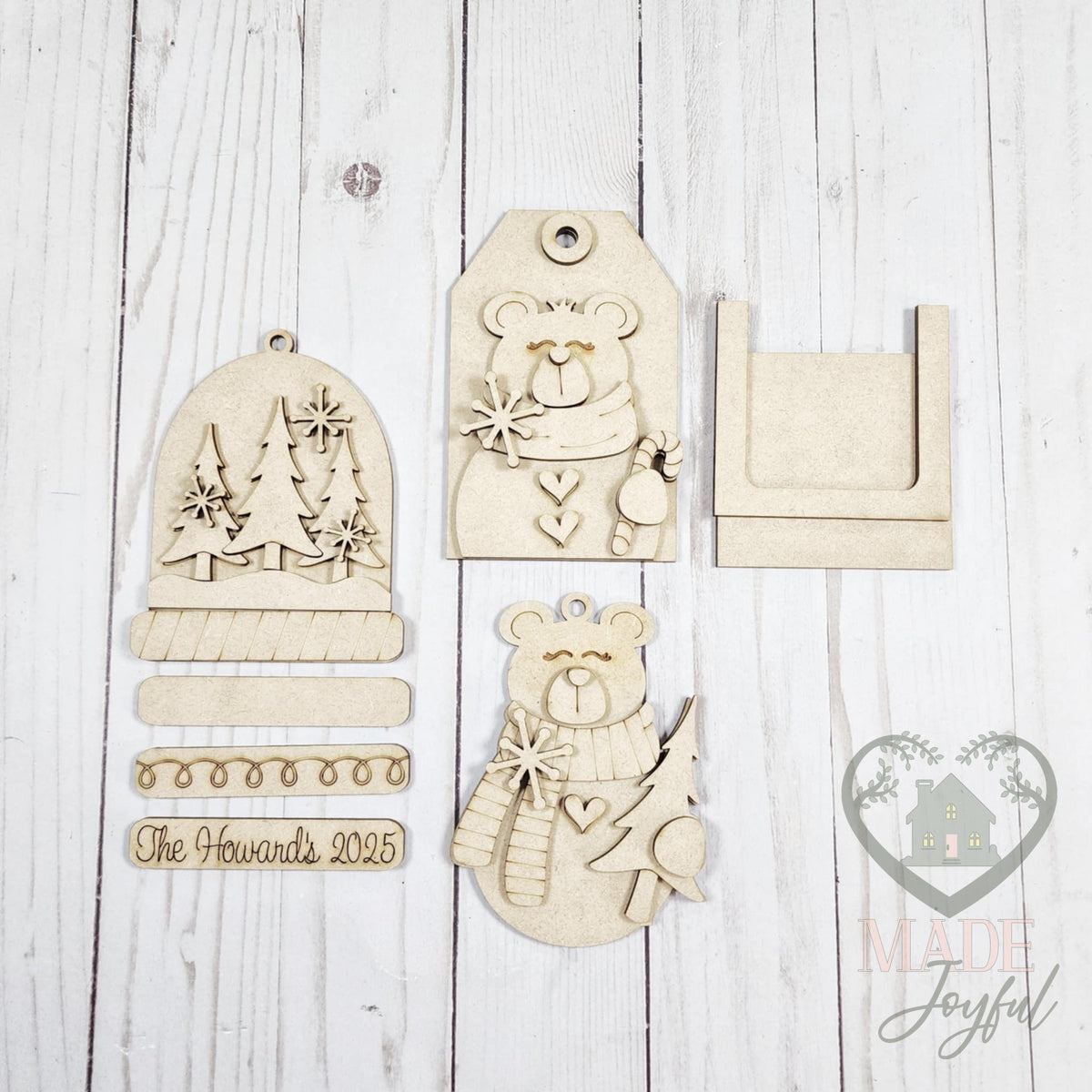 Unfinished laser-cut wood polar bear ornament kit with three ornaments, ready to paint at a DIY party in Williamson County, TN.