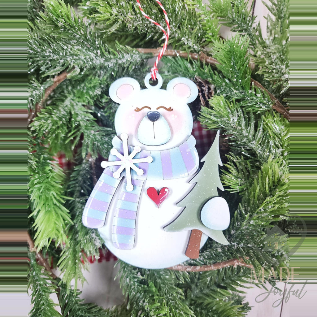 Standing polar bear ornament with a lavender plaid scarf, snowflake and pine tree, hand-painted in Brentwood, TN.
