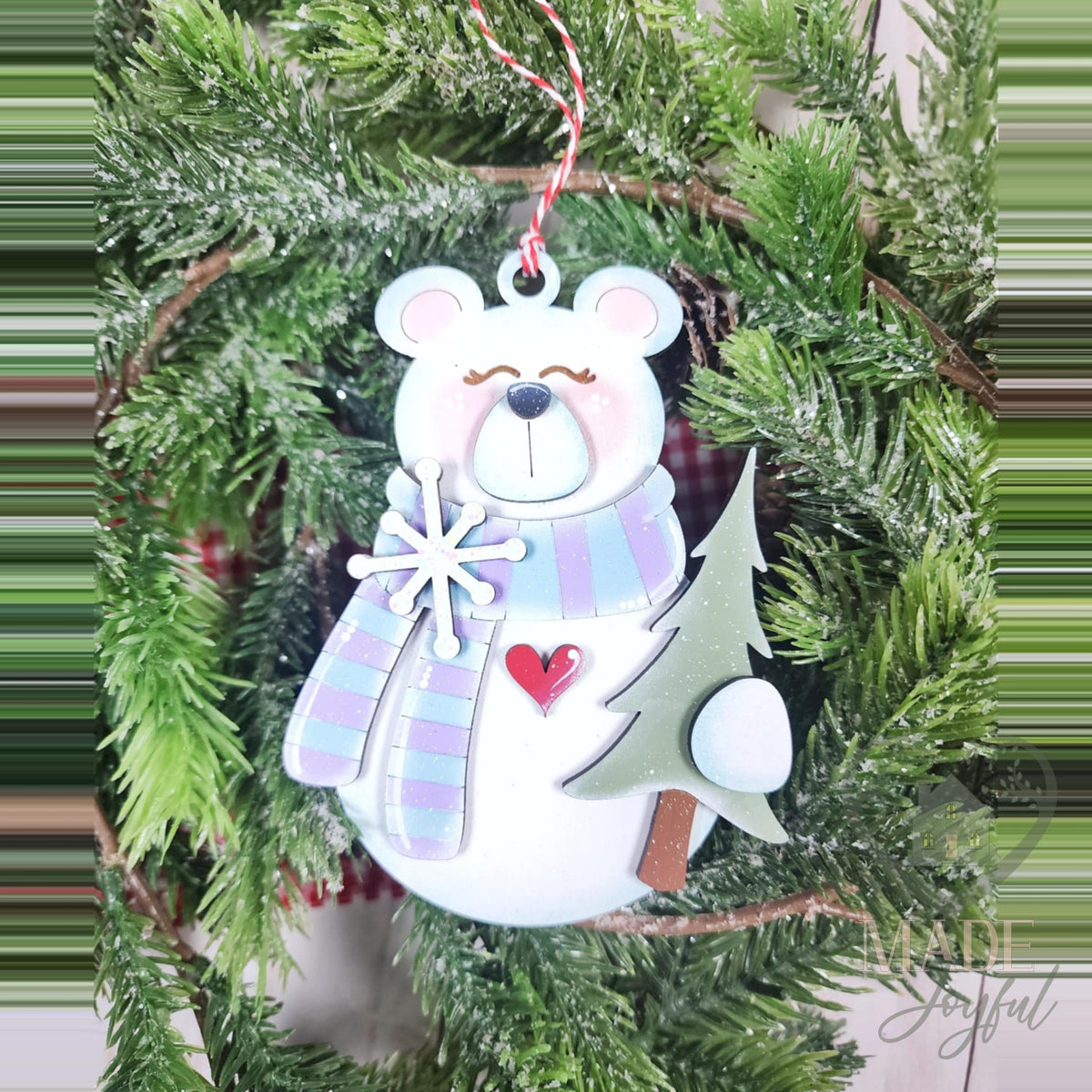 Standing polar bear ornament with a lavender plaid scarf, snowflake and pine tree, hand-painted in Brentwood, TN.
