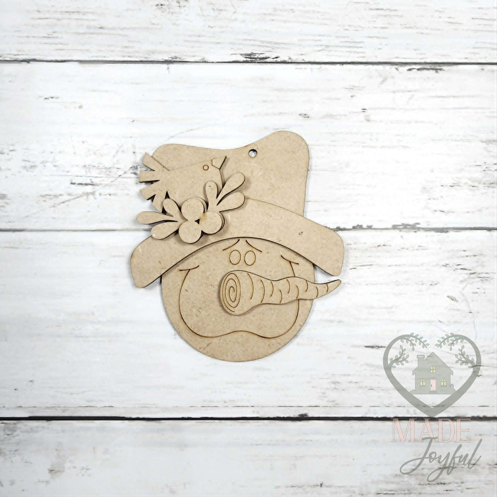 Unfinished laser-cut wood snowman face ornament kit, ready to paint at a DIY party in Williamson County, TN.