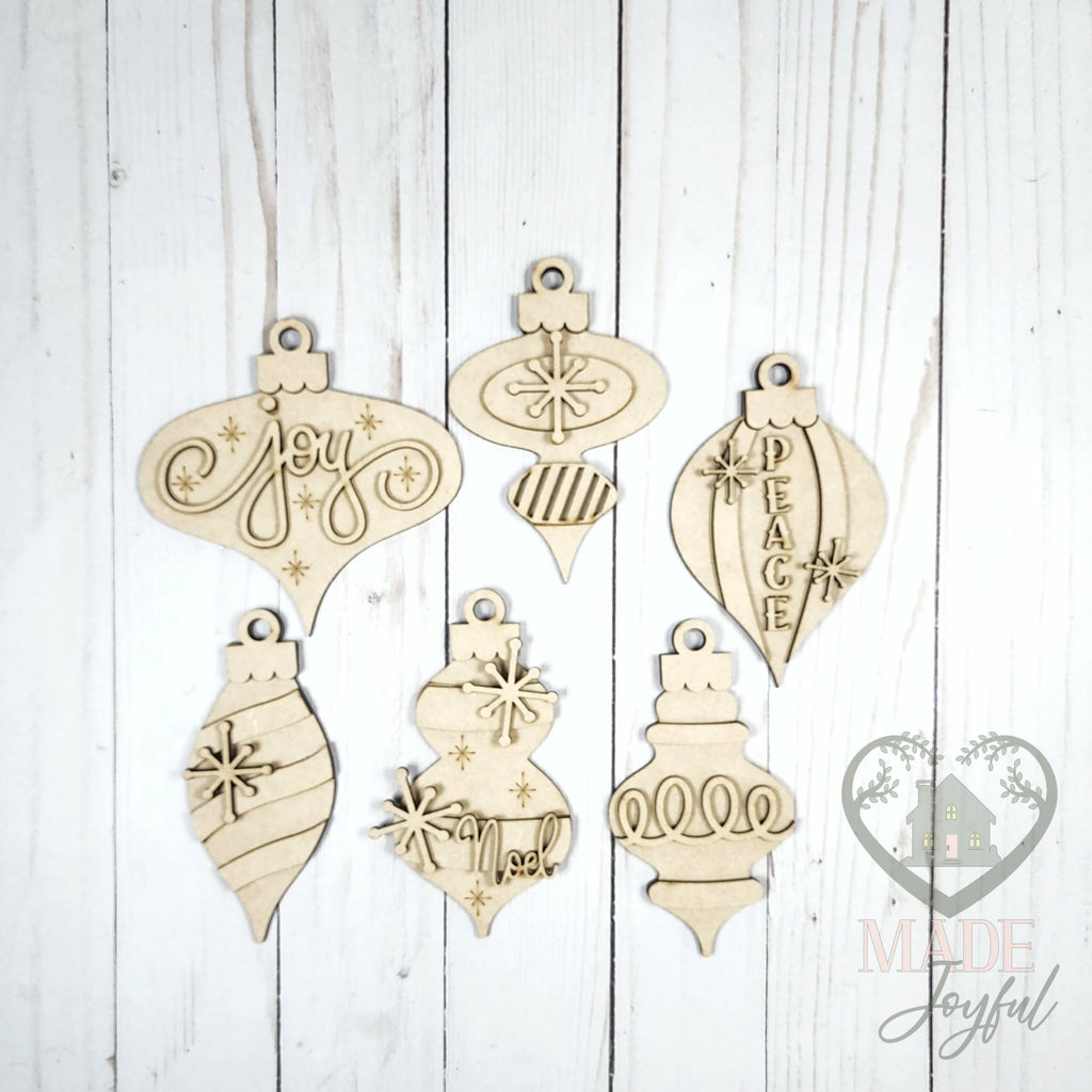 Unfinished laser-cut wood vintage ornament kit with six ornaments, ready to paint at a DIY party in Williamson County, TN.