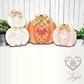 Trio of sweater-knit pumpkin shelf sitters in white, orange, and pink with lattice hearts and burlap bows, hand-painted in Brentwood, TN.