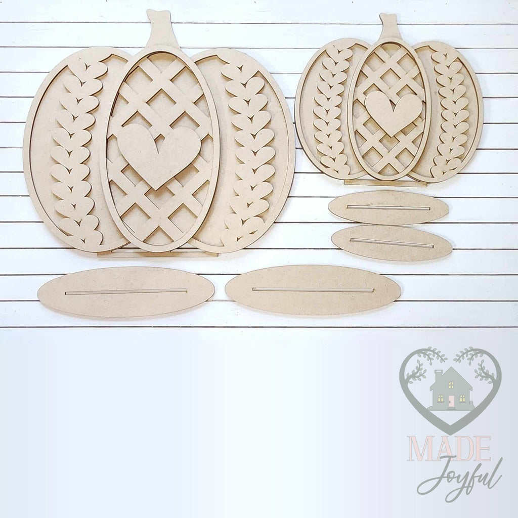 Unfinished laser-cut wood Sweater Weather Pumpkin Shelf Sitters DIY kit (large and small pieces), ready to paint at a DIY party in Williamson County, TN.