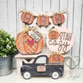 Sweater Weather tiered tray decor set with knit pumpkins, Stay Cozy round sign, black pumpkin truck, and pumpkin banner, hand-painted in Brentwood, TN.