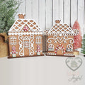 Pair of frosted gingerbread house shelf sitters with white icing roofs and candy trim, hand-painted in Brentwood, TN.